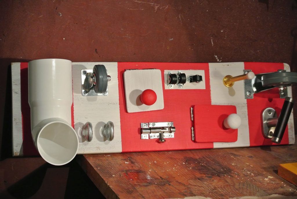 toddler activity board with latches and locks